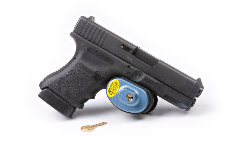 Glock pistol handgun with trigger lock installed isolated on white background