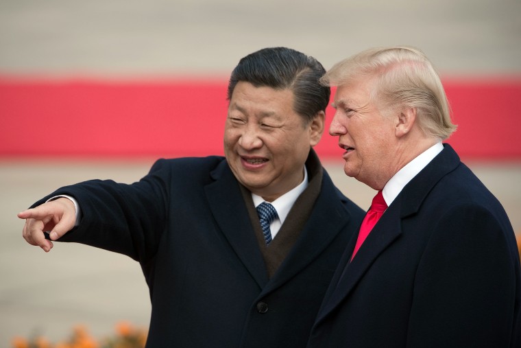 Xi Jinping and Donald Trump attend a welcome ceremony at the Great Hall of the People in Beijing