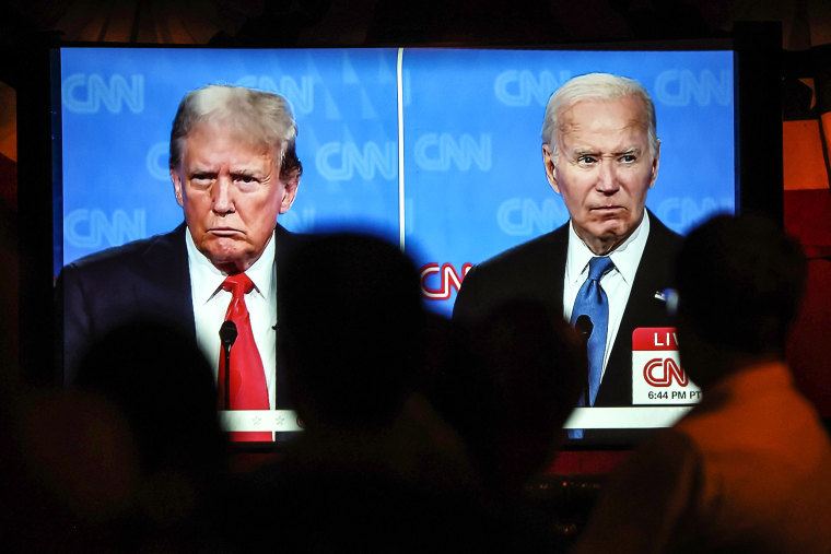 Image: People watch the CNN presidential debate between President Joe Biden and former President Donald Trump