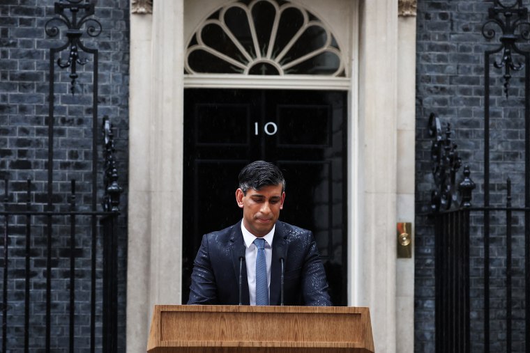 Britain's Prime Minister Rishi Sunak stands at a lecturn as he delivers a speech to announce July 4 as the date of the UK's next general election, at 10 Downing Street in central London, on May 22, 2024.