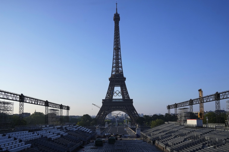 The Paris Olympics organizers mounted the rings on the Eiffel Tower on Friday as the French capital marks 50 days until the start of the Summer Games. The 95-foot-long and 43-foot-high structure of five rings, made entirely of recycled French steel, will be displayed on the south side of the 135-year-old historic landmark in central Paris, overlooking the Seine River. 