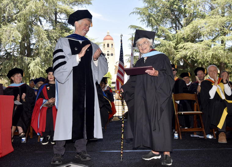 Virginia Hislop accepting her diploma for her master of arts in education at the GSE’s 2024 commencement ceremony from Dean Dan Schwartz.