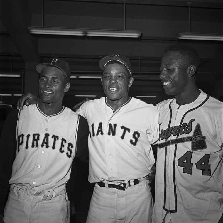 Baseball Players Standing Together in Locker Room