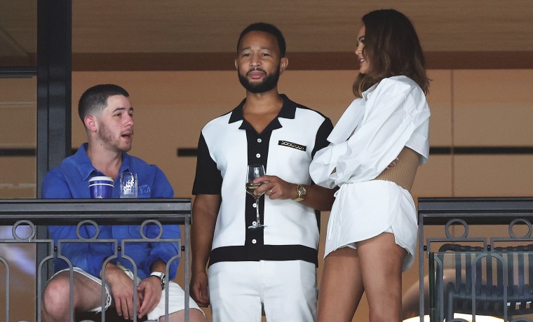 Nick Jonas with John Legend and Chrissy Teigen during the Artistic Gymnastics Women's Qualification during the Olympic Games.