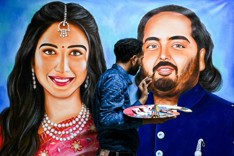 Artist Jagjot Singh Rubal paints Anant Ambani and his fiancée Radhika Merchant ahead of their wedding in Amritsar on July 10, 2024. 