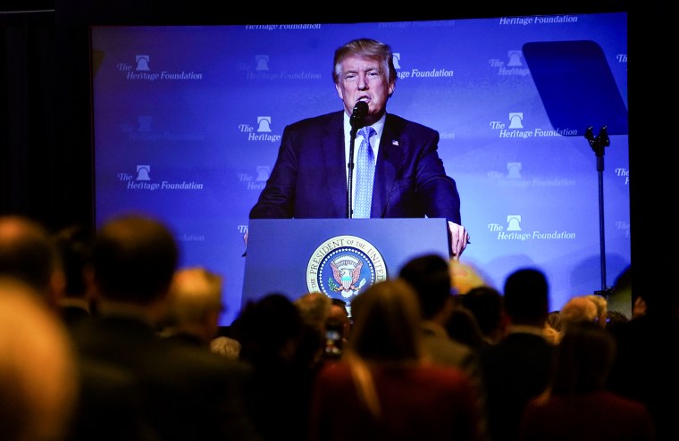 President Donald Trump is seen projected on a screen as he speaks at the Heritage Foundation's annual President's Club meeting  in Washington on Oct. 17, 2017.