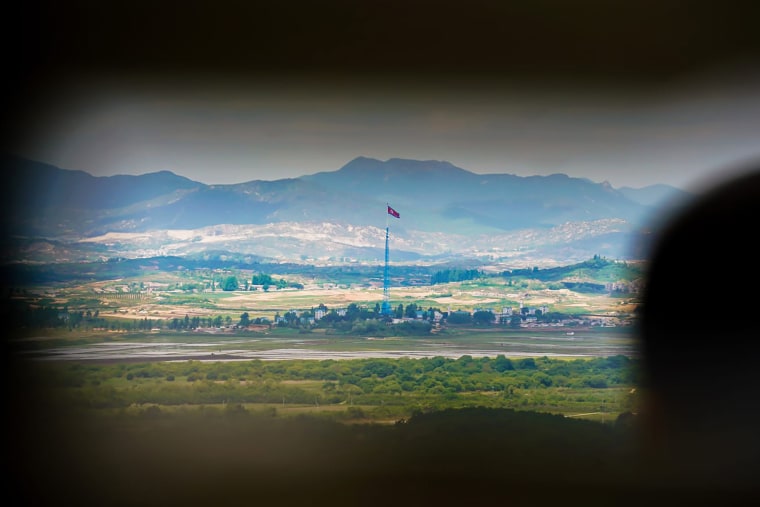A visitor observes the Korean border from an observatory inside the Demilitarized Zone on May 18.