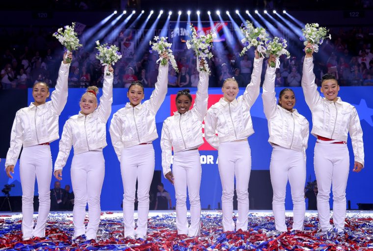 Hezly Rivera, Joscelyn Roberson, Suni Lee, Simone Biles, Jade Carey, Jordan Chiles and Leanne Wong pose after being selected for the 2024 U.S. Olympic Women's Gymnastics Team.