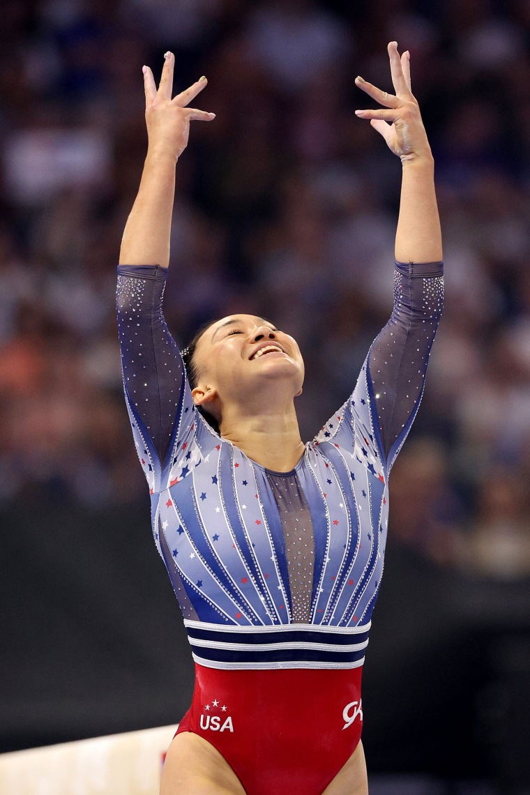 Leanne Wong reacts after finishing her routine on the balance beam