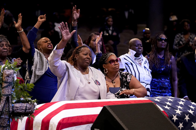 Chantemekki Fortson, front left, stands with friends and family during the funeral for Fortson.