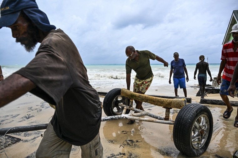 Hurricane Beryl plowed toward the southeast Caribbean early Monday as officials warned residents to seek shelter ahead of powerful winds and swells expected from the Category 3 storm. 