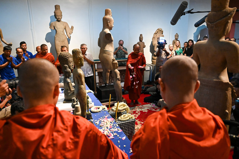 Buddhist monks take part in a repatriation ceremony for Angkorian artefacts returned from the United States at the National Museum in Phnom Penh on July 4, 2024. 