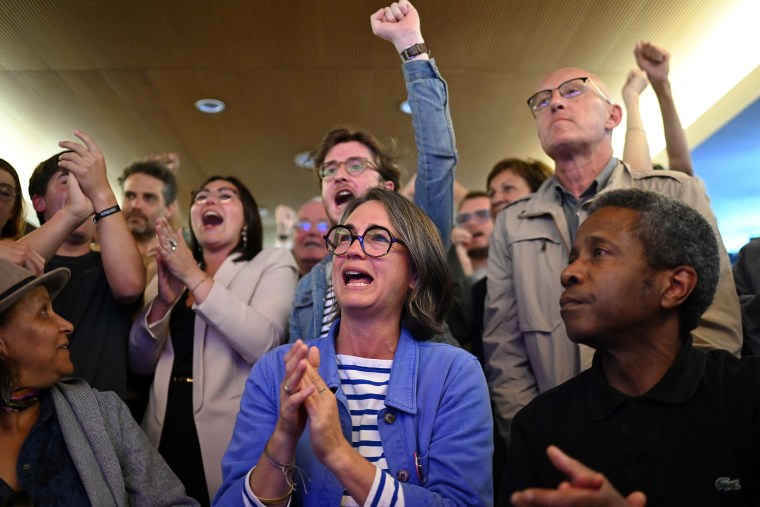 Forecasts showed a broad left-wing coalition heading into tough legislative elections in France ahead of both the president's centrists and the far-right, with no group winning an absolute majority. 