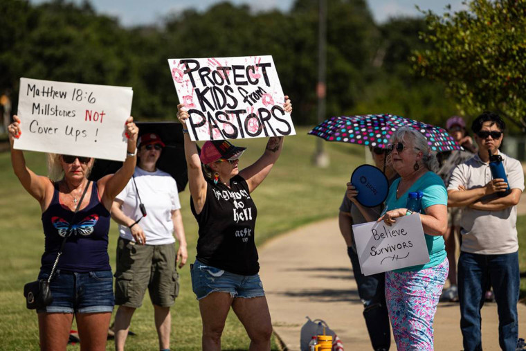 People gather outside Gateway Church in protest of child sexual abuse in the church