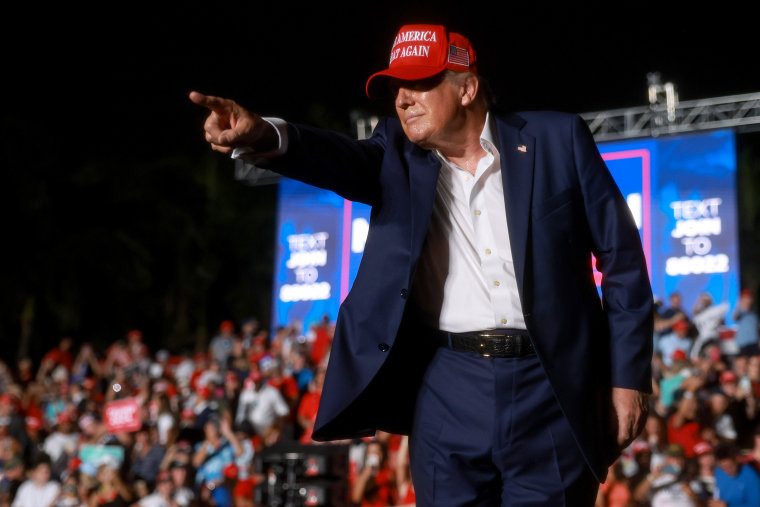 Image: Former President Donald Trump Holds A Campaign Rally In Doral, Florida politics political politician maga hat rally gesture point