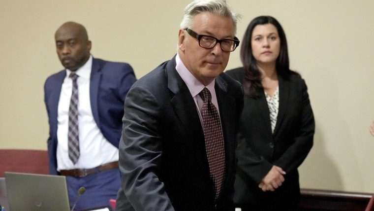 Actor Alec Baldwin leans on a chair during a break in his hearing in Santa Fe County District Court, July 10, 2024, in Santa Fe, New Mexico. 