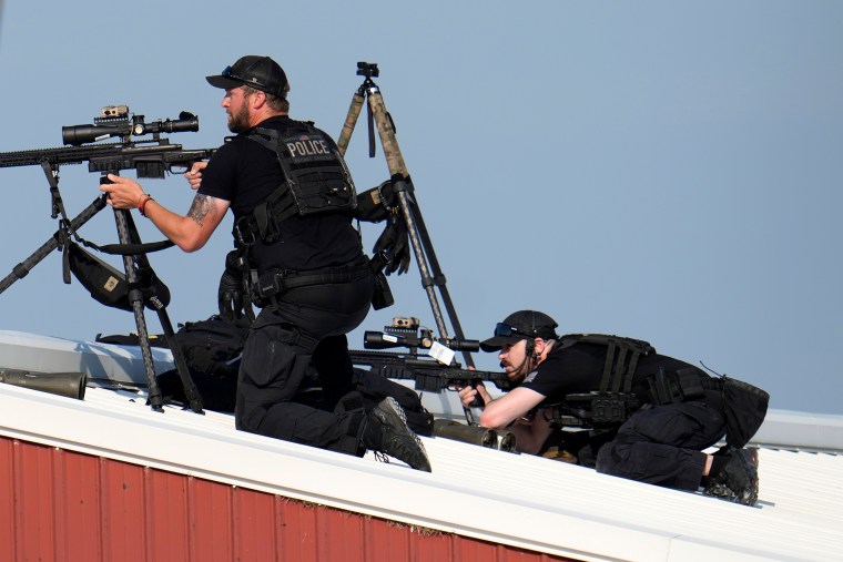 Police snipers return fire 