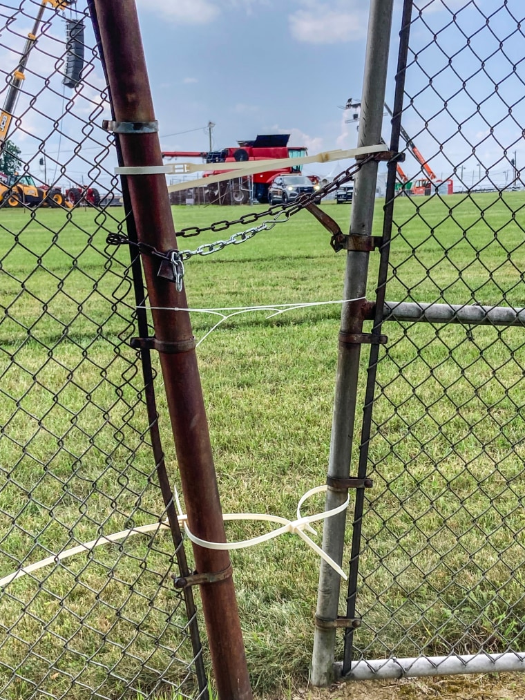 Zip ties are used to secure two fences that separated the lot where the shooter was with the rally in Butler, Pa.,