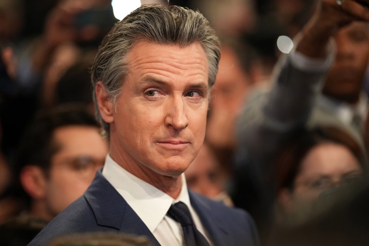 Gavin Newsom speaks to reporters in the spin room following the CNN Presidential Debate between Joe Biden and Donald Trump at the McCamish Pavilion on the Georgia Institute of Technology campus in Atlanta