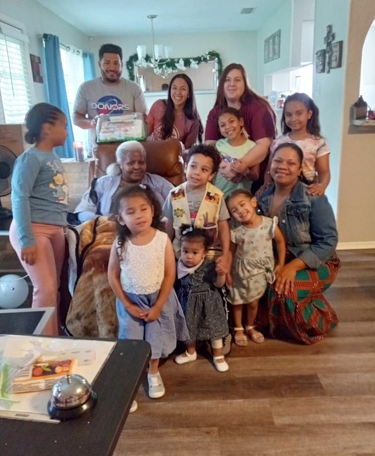 Pamela Jarrett, seated, with her family. 