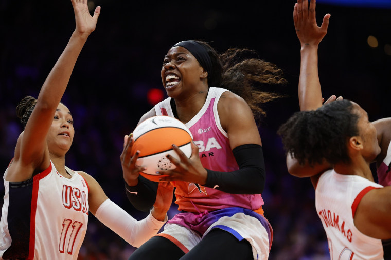 Arike Ogunbowale of Team WNBA goes up over Napheesa Collier of Team USA during the 2024 WNBA All Star Game.