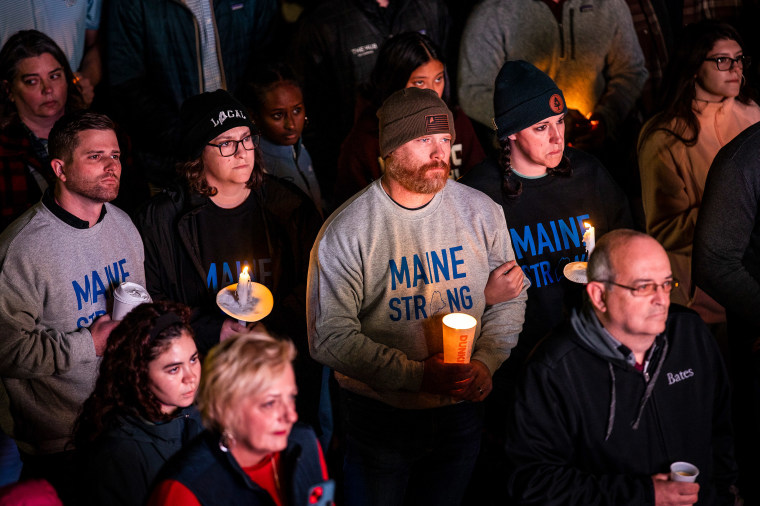 People hold candles