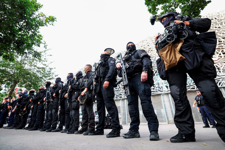 Members of the French BRI police unit stand guard during the Paris 2024 Olympic Games at the Parc des Princes in Paris on July 24, 2024.