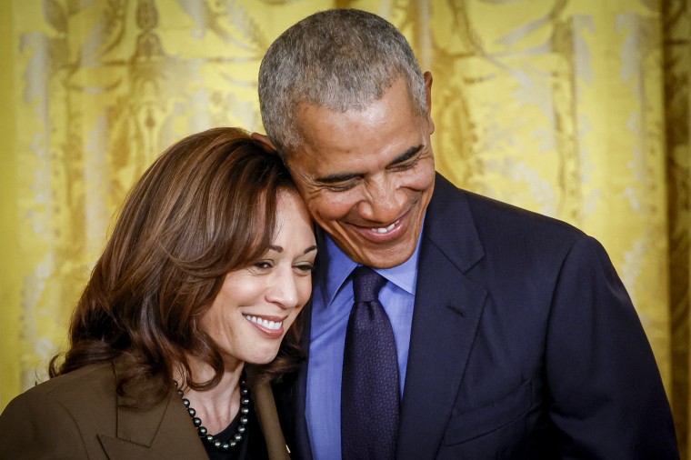 Barack Obama hugs Kamala Harris.