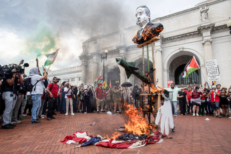 Protesters burned the American flag.