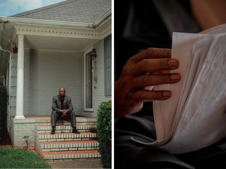 Terry Belk at his home in Charlotte, N.C., on July 21, with medical paperwork. Belk said he is paying $100 a month to whittle down his debt and keep bill collectors away.