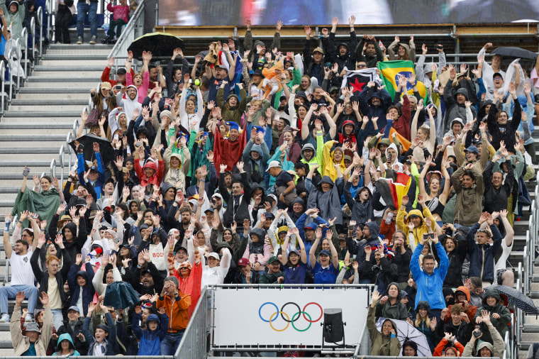 Spectators cheer.