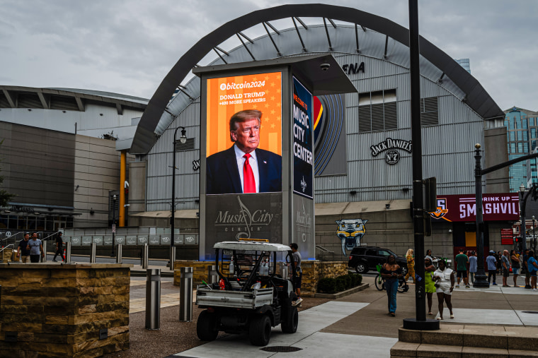 Donald Trump's photograph on a digital display outside of the venue.