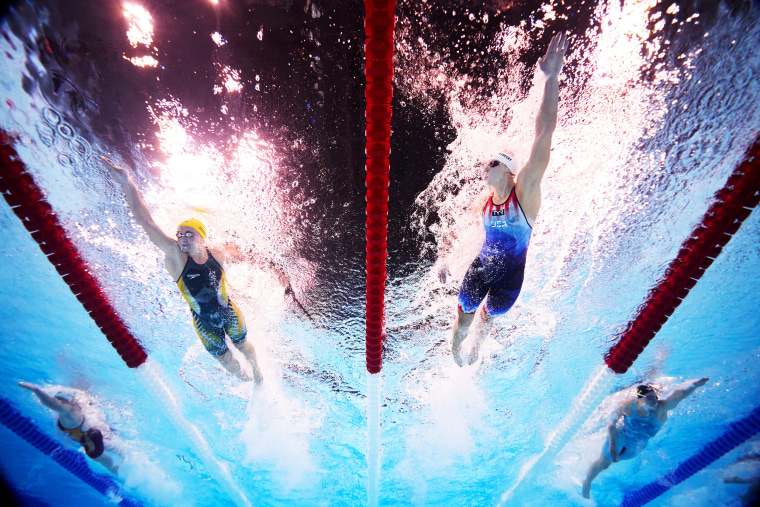 Ariarne Titmus of Team Australia and Katie Ledecky of Team United States compete in the Women's 400m Freestyle Heats on day one of the Olympic Games Paris 2024 at Paris La Defense Arena on July 27, 2024 in Nanterre, France.