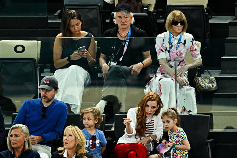 Australian director Baz Luhrmann and Vogue editor-in-chief Anna Wintour and actress Jessica Chastain attend the artistic gymnastics women's qualification during the Paris 2024 Olympic Games at the Bercy Arena in Paris, on July 28, 2024.