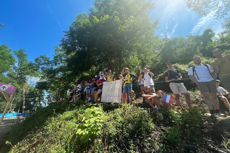 Spectators gather to watch the cross country cycling.