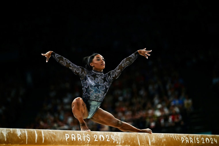 Simone Biles competes in the balance beam event of the artistic gymnastics women's qualification during the Paris 2024 Olympic Games at the Bercy Arena in Paris, on July 28, 2024.