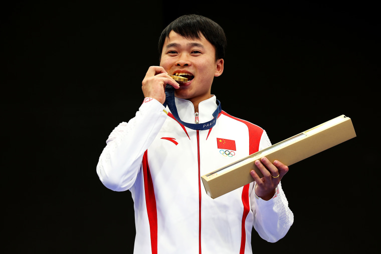 China's Yu Xie wins gold in the Men's 10m Air Rifle during the Paris 2024 Olympic Games at Chateauroux Shooting Centre on July 28, 2024 in Chateauroux, France. 