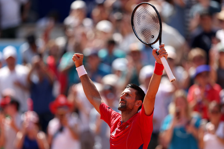 Novak Djokovic celebrates winning against Rafael Nadal