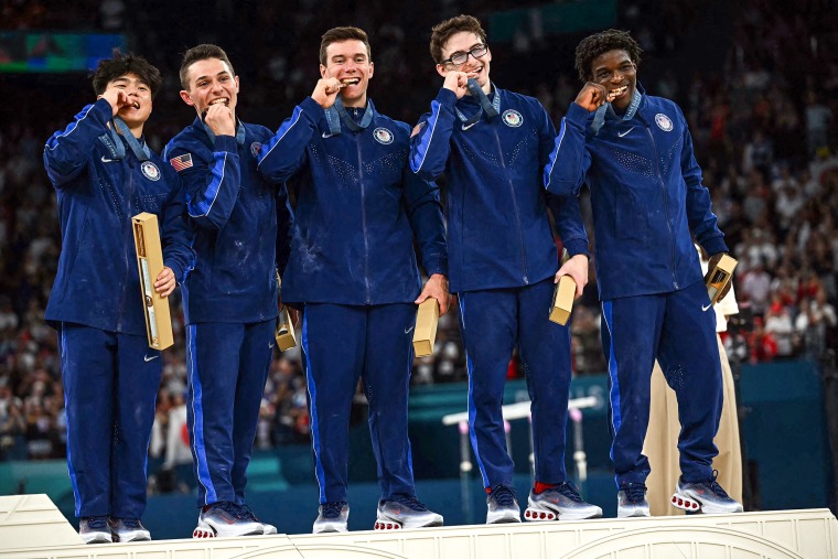 Image: Team USA poses with their bronze medal 