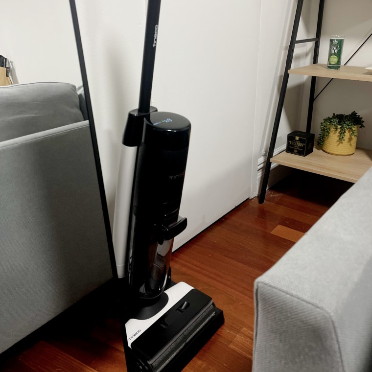 Tineco Floor One S7 Pro Smart Cordless Floor Washer charges on its black dock.