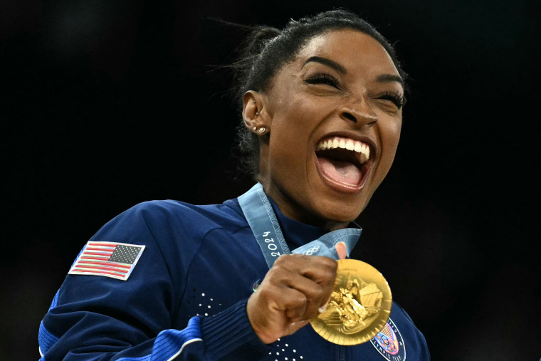 Simone Biles celebrates during the podium ceremony for the artistic gymnastics women's team final during the Olympics in Paris