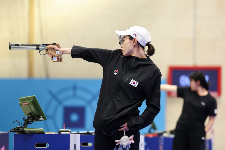 Kim Yeji shoots a pistol