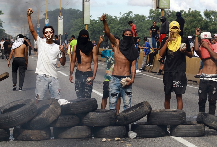 Demonstrators set up a barricade during a protest against Venezuelan President Nicolas Maduro's government in Valencia, Venezuela