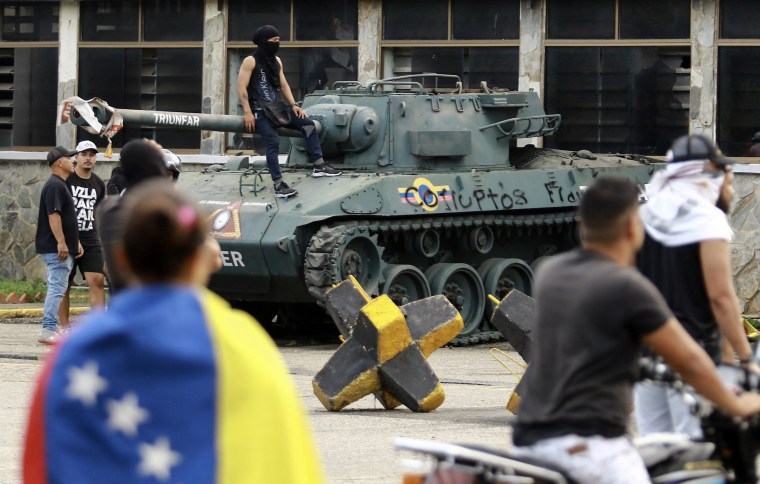 Demonstrators gather during a protest against Venezuelan President Nicolas Maduro's government in Valencia, Venezuela, 