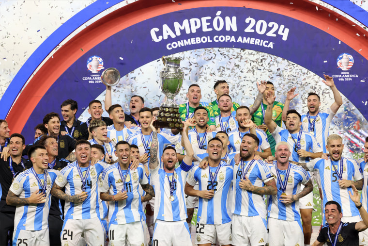 Lionel Messi, No. 10, lifts up the trophy as he celebrates winning the Conmebol 2024 Copa America tournament final match between Argentina and Colombia at the Hard Rock Stadium, in Miami, Florida.