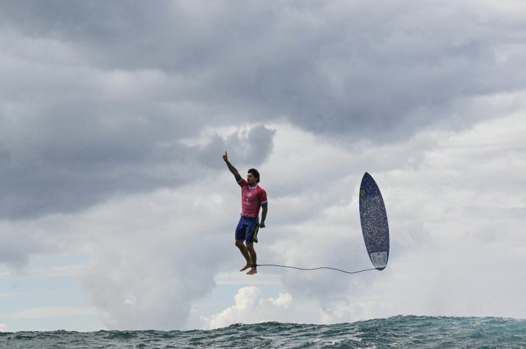 Brazil's Gabriel Medina reacts after getting a large wave in the 5th heat of the men's surfing round 3, during the Paris 2024 Olympic Games