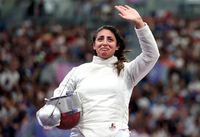 Nada Hafez of Team Egypt applauds fans after her victory against Elizabeth Tartakovsky of Team United States (not pictured) in the Fencing Womens Sabre Individual Table of 32 on day three of the Olympic Games Paris 2024 at Grand Palais on July 29, 2024 in Paris, France. 