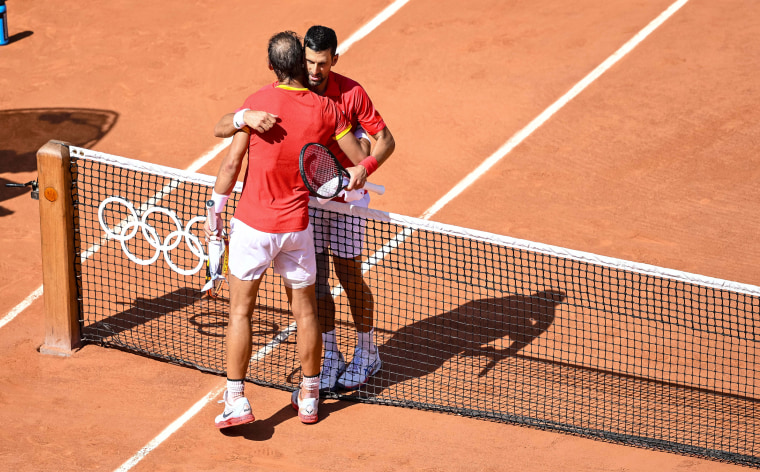 Rafael Nadal and Novak Djokovic hugging during the Olympic Games.