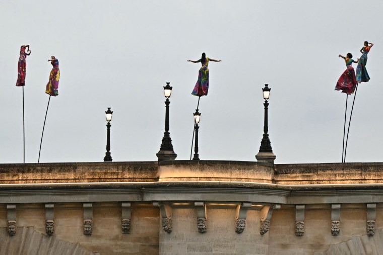 Artists perform on the Pont Neuf.