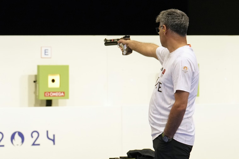 Turkey's Yususf Dikec competes in the 10m air pistol mixed team gold medal event at the 2024 Summer Olympics, Tuesday, July 30, 2024, in Chateauroux, France. 
